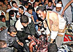PALESTINIANS REMOVE BODY OF HAMAS LEADER'S BODYGUARD AFTER ISRAELI AIRSTRIKE IN GAZA (Ahmed Jadallah/REUTERS)