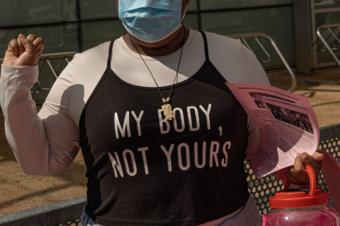 young black woman with t-shirt "my body not yours"