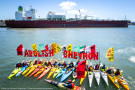 Kayaks confront oil tankers